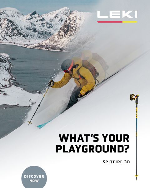 Uno sciatore in giacca gialla e occhiali da sci scende un pendio innevato con i bastoncini. Sullo sfondo si vedono montagne innevate e un lago. Il testo recita "QUAL È IL TUO TERRENO DI GIOCO? SPITFIRE 3D" con un pulsante "SCOPRI ORA".