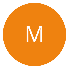Un cerchio arancione con una lettera "M" bianca al centro.