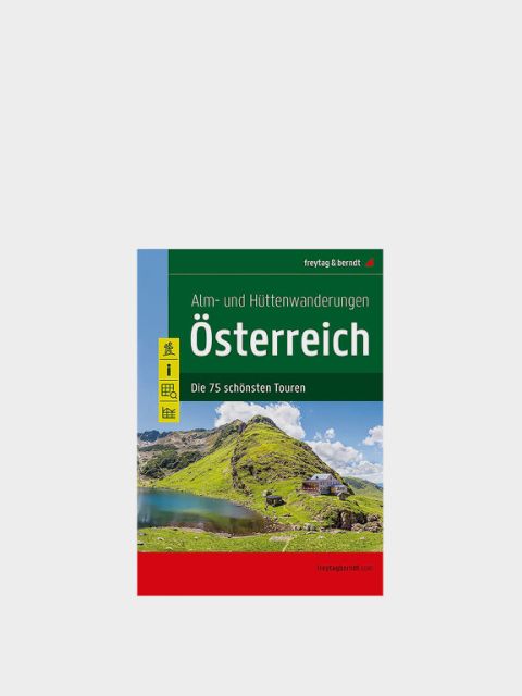 Copertina di una guida escursionistica intitolata "Escursioni a malghe e rifugi Austria" con l'immagine di un pittoresco paesaggio montano verde e un piccolo rifugio. Il testo indica "I 75 tour più belli", pubblicati da Freytag & Berndt.