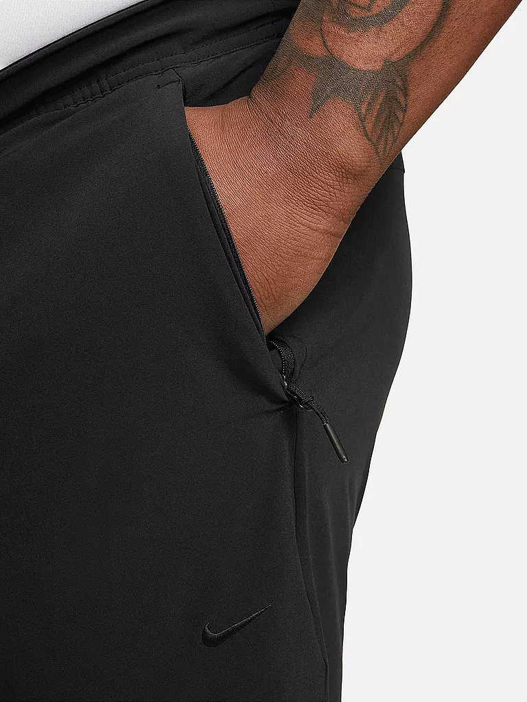 NIKE | Pantaloni da fitness Unlimited da uomo | 